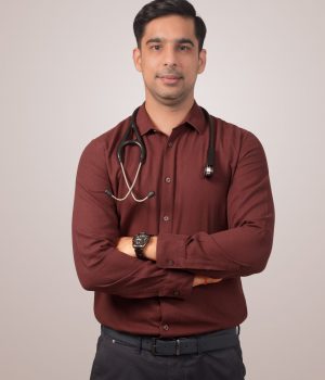 Dr Raghav Oza, professional psychiatrist, posing with a stethoscope for his official medical profile